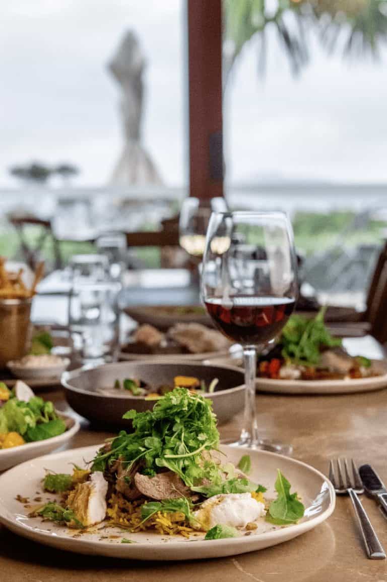 Food and wine table setting at Mudbrick Estate on Waiheke Island.